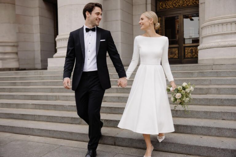 Bride in an ivory midi wedding dress with lace bodice and mid-calf skirt, photographed outdoors at golden hour