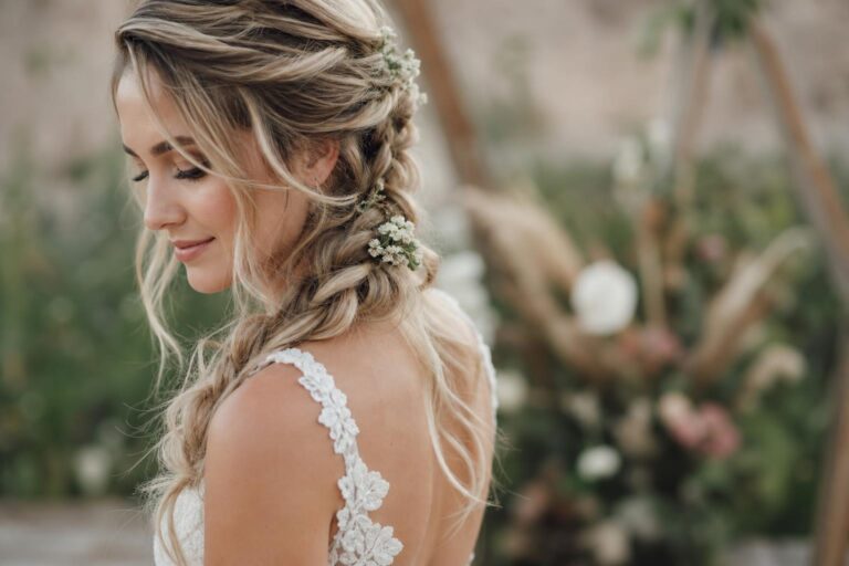 Boho braid wedding hair with soft texture and loose waves, photographed from behind for a romantic bridal look