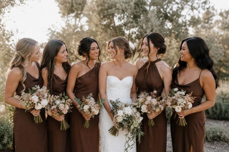 Brown bridesmaid dresses in soft mocha and espresso tones, styled for a modern romantic wedding in natural light