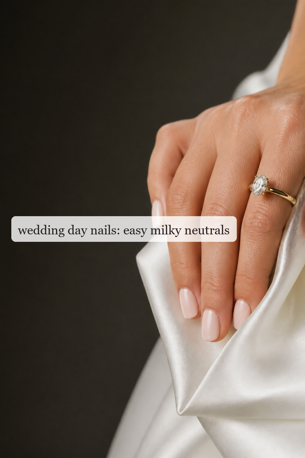 Wedding day nails in a glossy milky blush neutral beside a ring